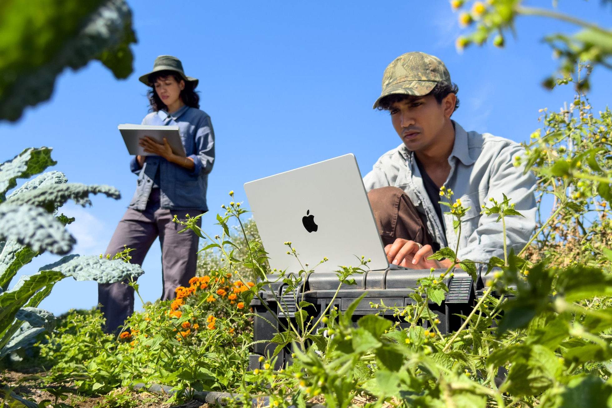 A person working on the 14-inch MacBook Pro with M6