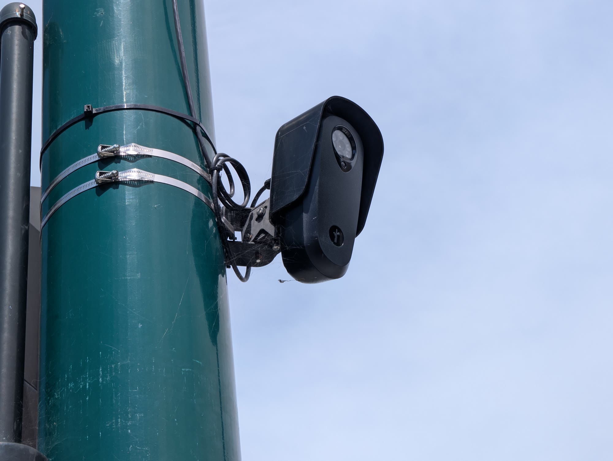A Flock Safety license plate reader camera mounted on a street pole in Hayward, California