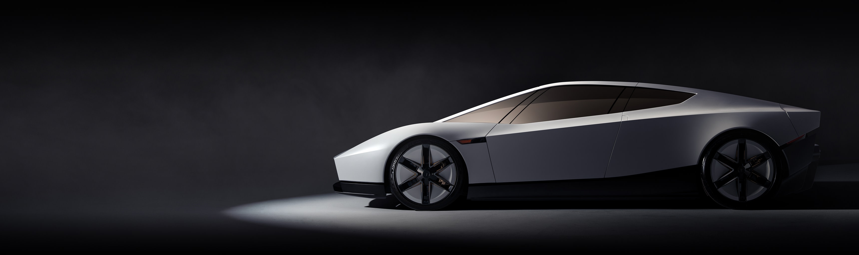 Side view of the white 2026 Tesla Roadster in a dark studio