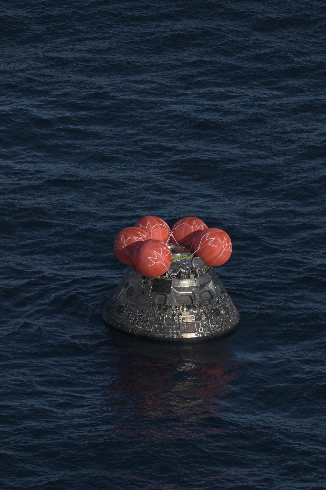 Orion capsule floating in the Pacific after the Artemis II splashdown